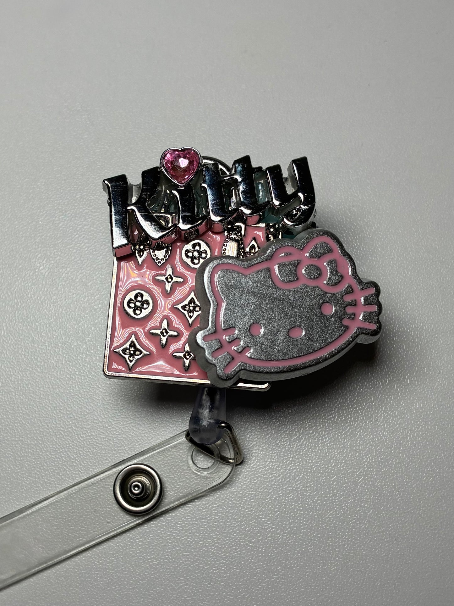 LV KITTY BADGE REEL