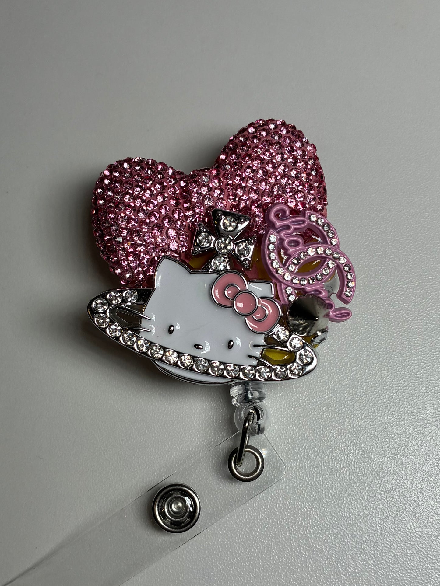 CC PLUTO BADGE REEL