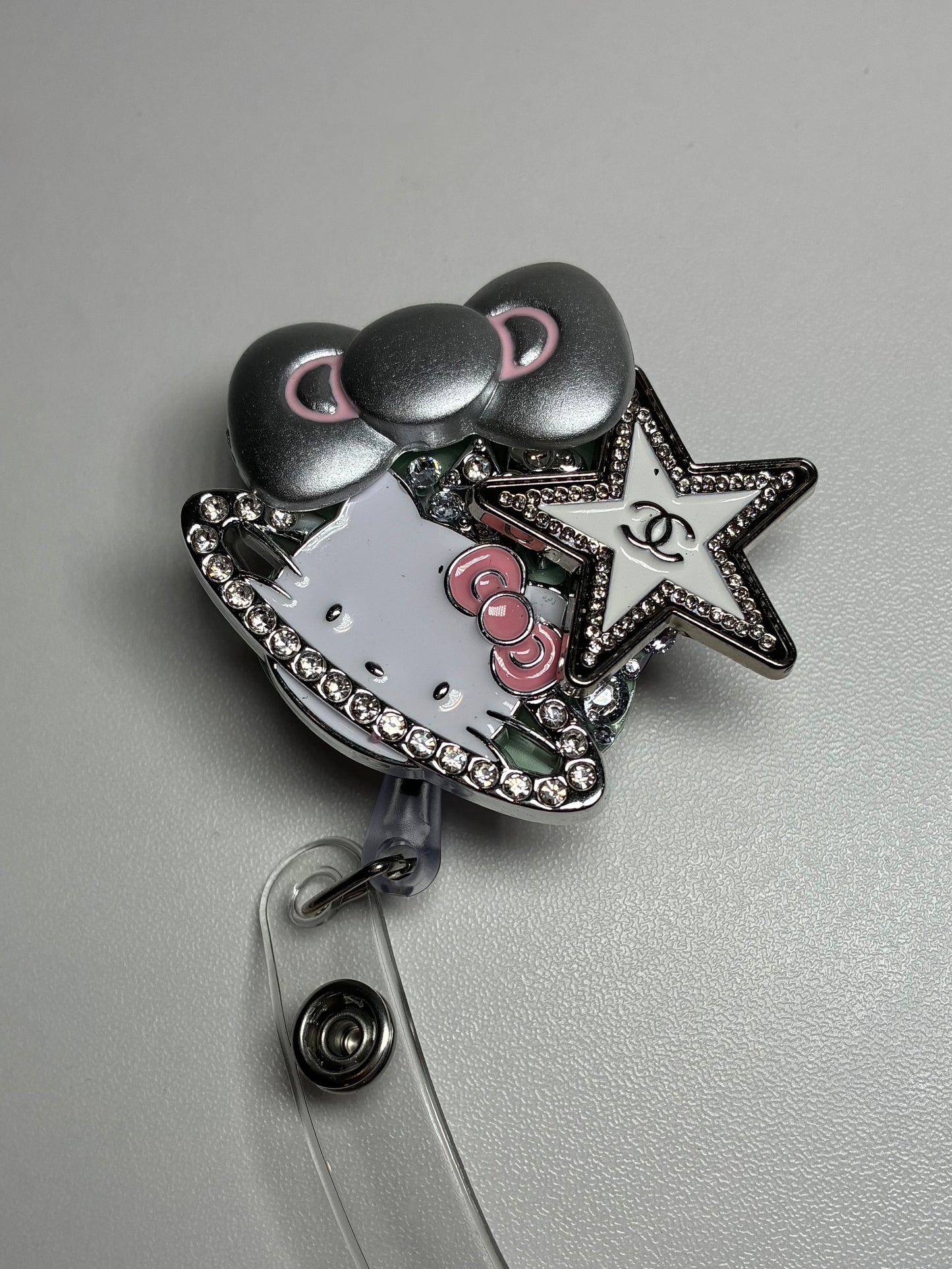 HK PLUTO BADGE REEL